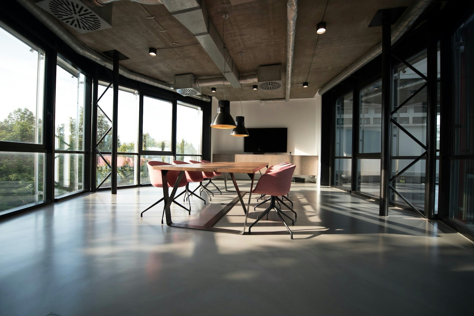 Bright growth atrium workspace with daylight and funnel planning surfaces
