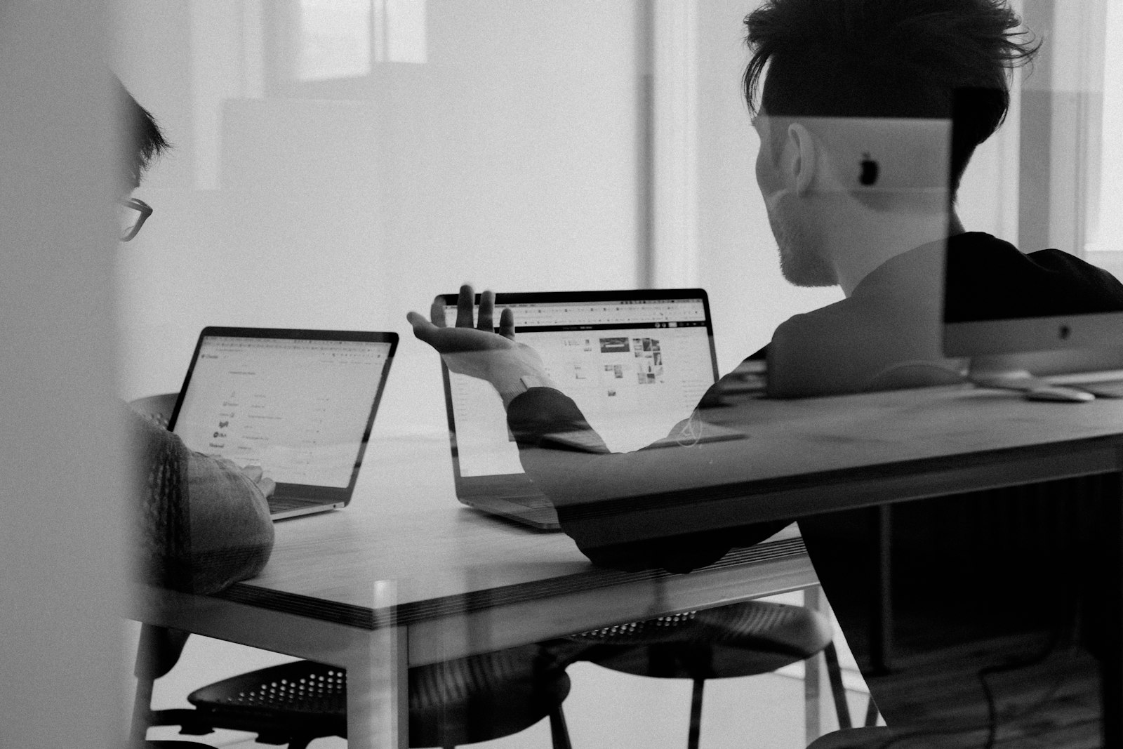Team workshopping funnel stages on a bright studio wall